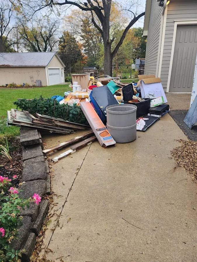 Dumpster being loaded with debris for Estate Cleanout Dumpster Rental in Wyomissing
